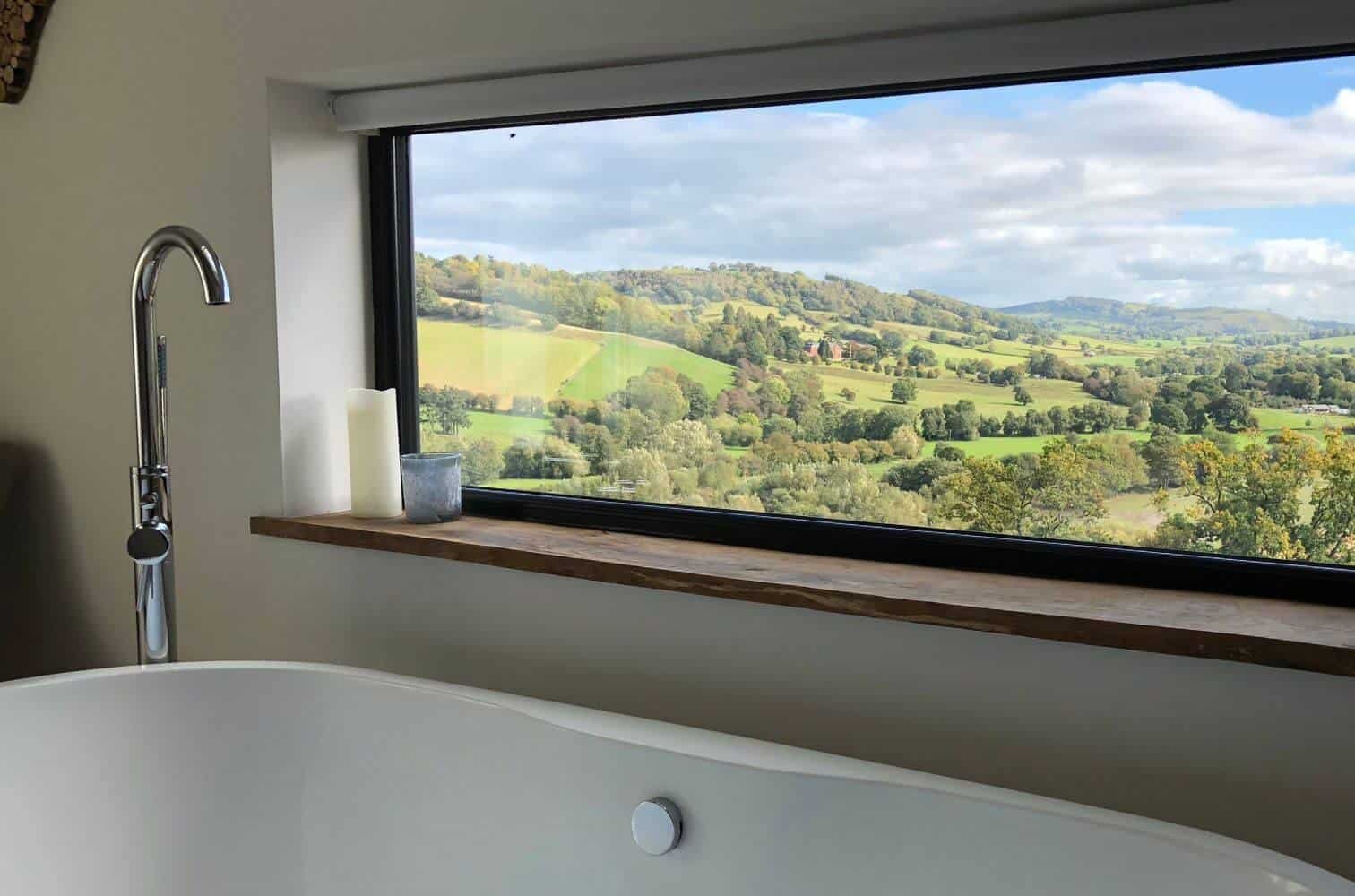 a view of welsh countryside from a indoors bath tub