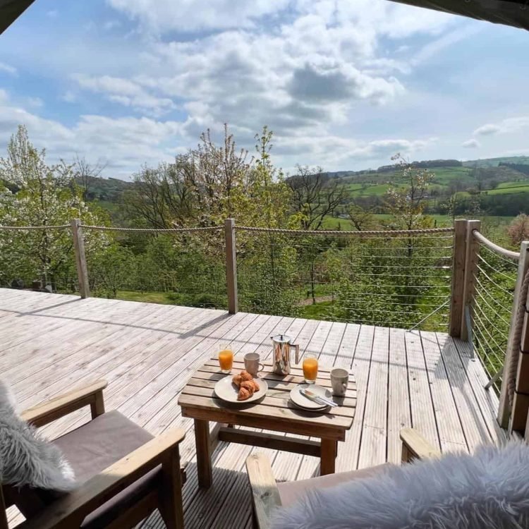 Wide deck area with stunning views across the Mid Wales landscape from the safari tent.