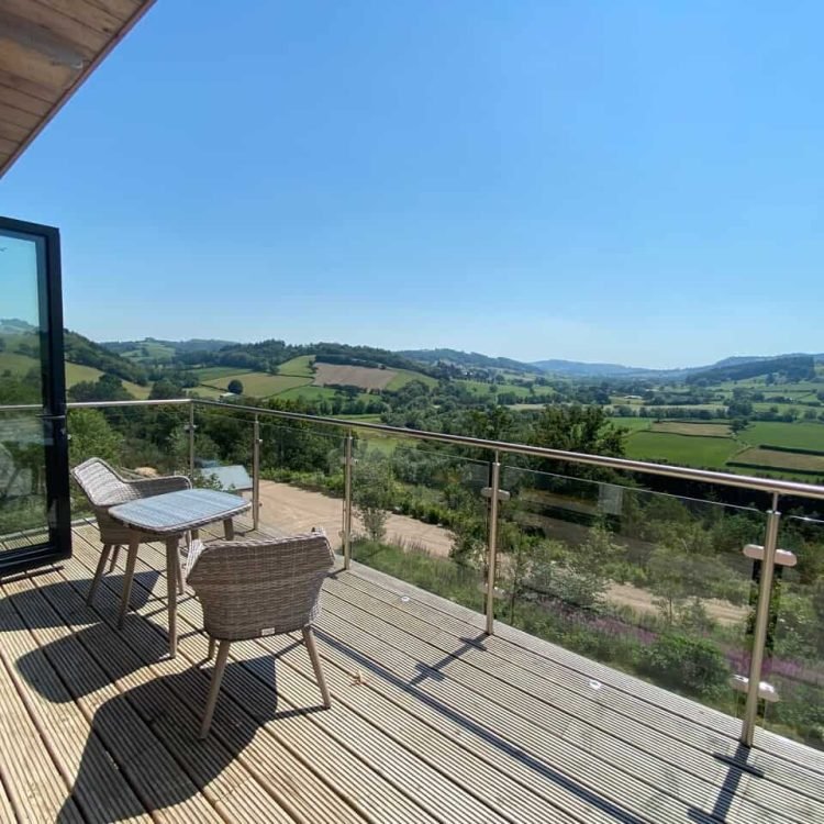view from decking of oaklands treehouse towards the welsh countryside