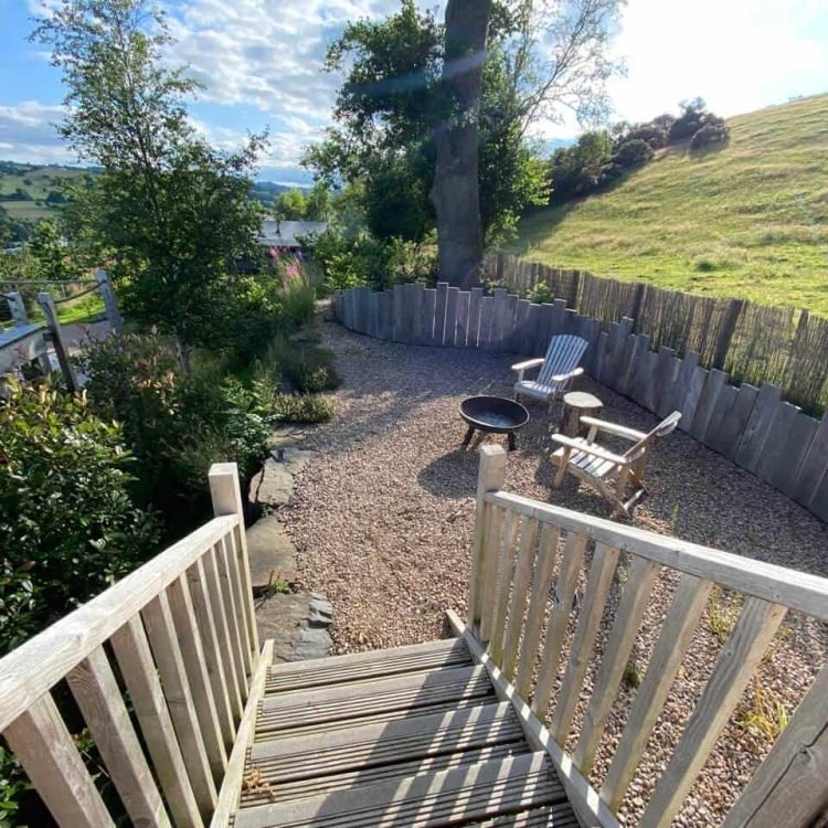 a view of a outdoor seating area by wooden decking in wales
